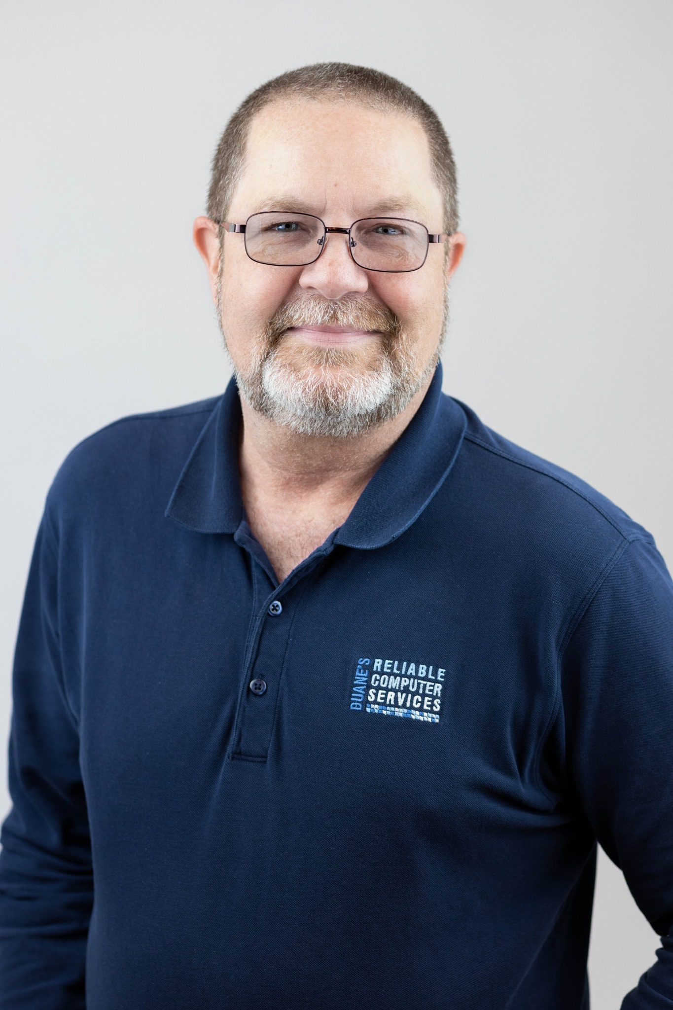 Duane McHodgkins wearing his navy DRCS polo